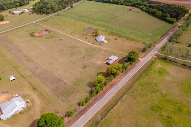 birds eye view of property with a rural view