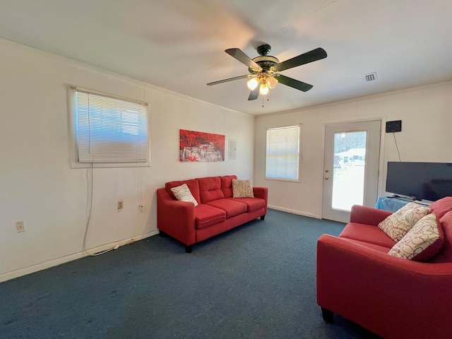 living room with visible vents, carpet floors, and ornamental molding