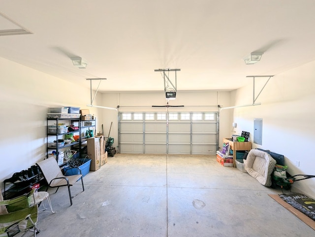 garage featuring a garage door opener and electric panel