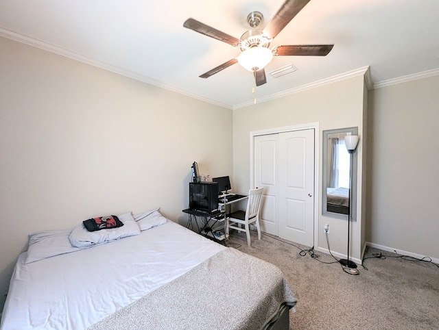 carpeted bedroom featuring baseboards, visible vents, a ceiling fan, and crown molding