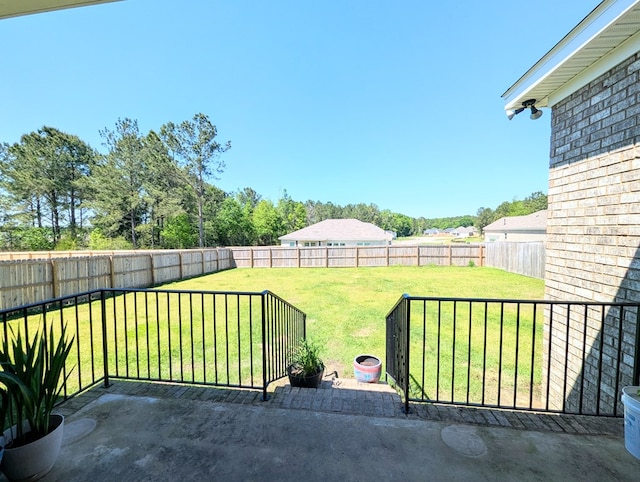 view of yard featuring a patio and a fenced backyard