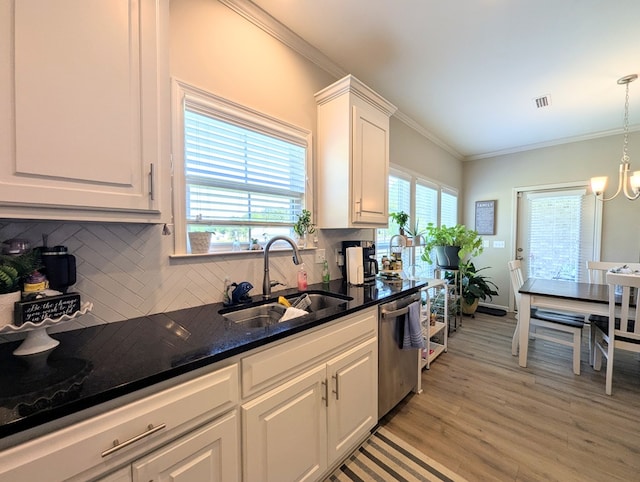 kitchen featuring a sink, light wood-style floors, backsplash, dishwasher, and white cabinets