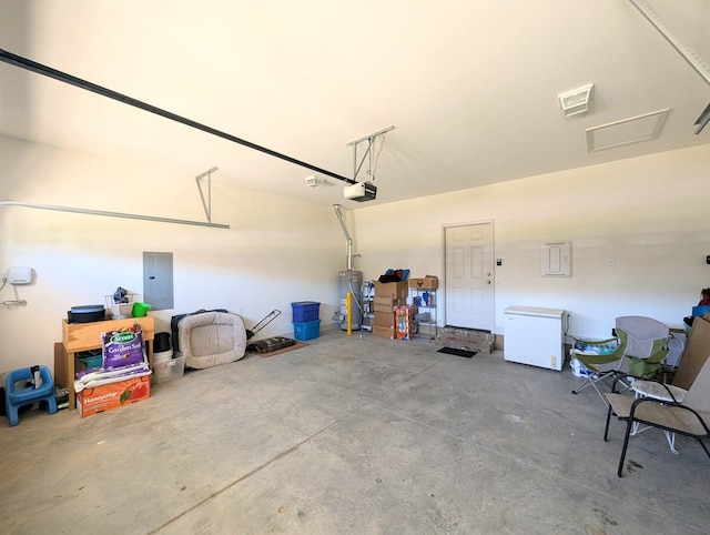 garage with gas water heater, refrigerator, electric panel, and a garage door opener