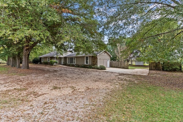 single story home with a garage