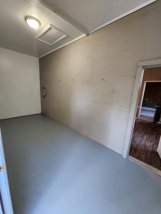 unfurnished room with concrete floors