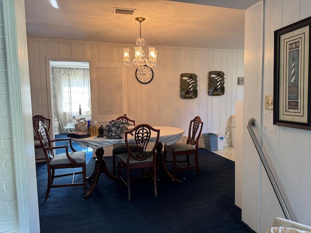 dining space featuring a chandelier