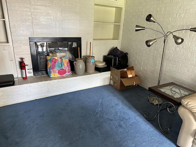 702 Highland St, Dothan, AL 36301 - carpeted living room featuring a brick fireplace and brick wall