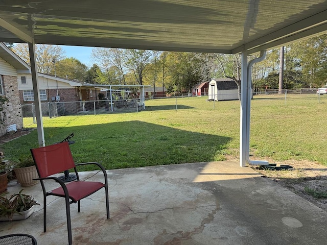 702 Highland St, Dothan, AL 36301 - view of yard featuring a patio area, a storage unit, and an outbuilding