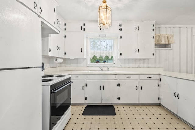 702 Highland St, Dothan, AL 36301 - kitchen with white appliances, a sink, and white cabinetry