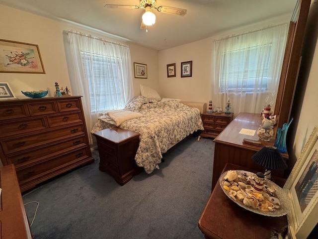 bedroom with dark carpet and ceiling fan