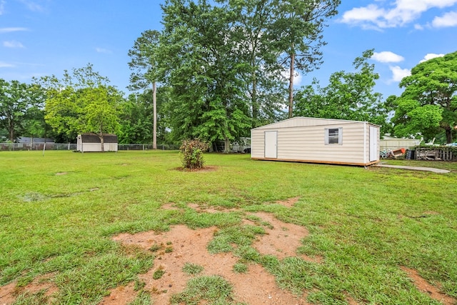 702 Highland St, Dothan, AL 36301 - view of yard with a shed, an outbuilding, and view of wooded area