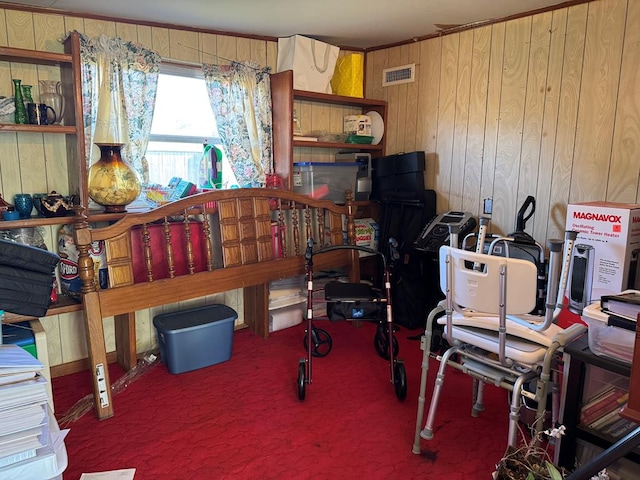 carpeted home office with wooden walls