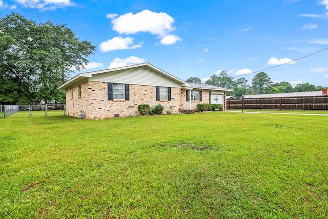 702 Highland St, Dothan, AL 36301 - back of property with an attached garage, crawl space, and brick siding
