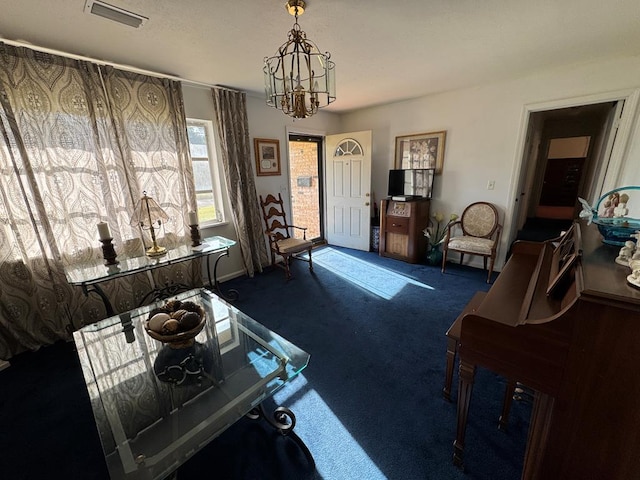 702 Highland St, Dothan, AL 36301 - carpeted living area featuring a chandelier and baseboards