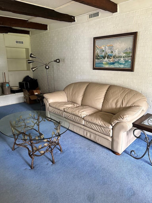 carpeted living room featuring beam ceiling