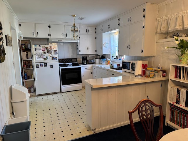 kitchen featuring freestanding refrigerator, electric range, light countertops, light flooring, and white cabinets