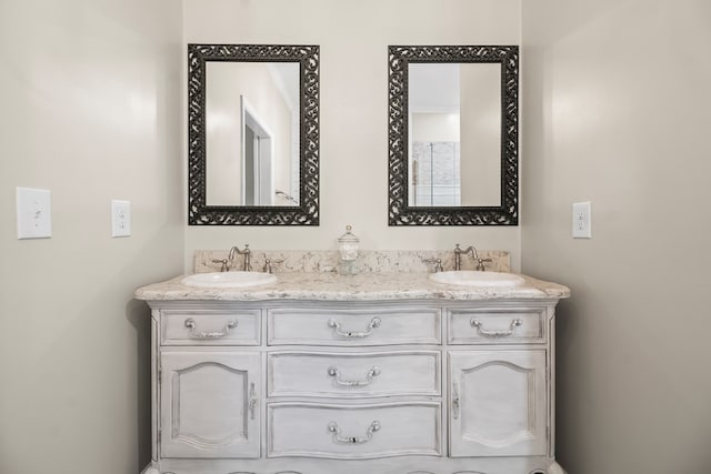 bathroom featuring a sink and double vanity