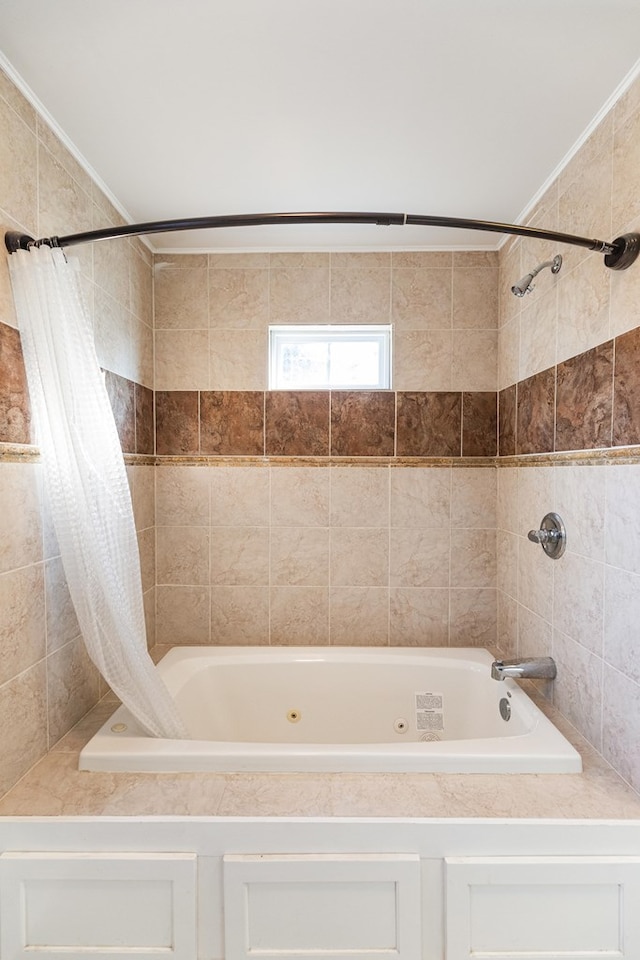 bathroom featuring shower / tub combo and crown molding