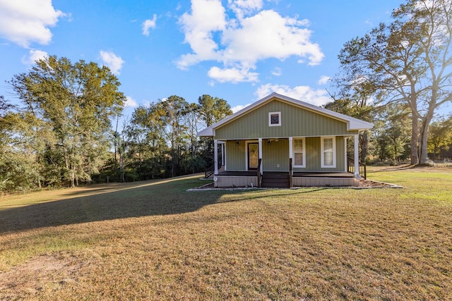 view of front of house with covered porch and a front yard