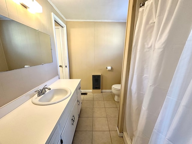 full bath with toilet, ornamental molding, heating unit, tile patterned flooring, and vanity