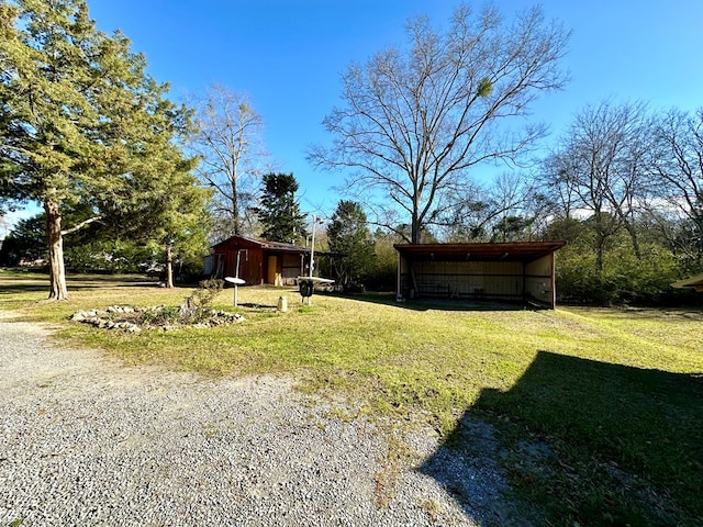 view of yard featuring an outbuilding and an outdoor structure