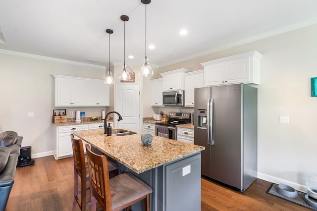 465 Choc Hill Rd, Dothan, AL 36303 - kitchen with stainless steel appliances, white cabinetry, ornamental molding, a breakfast bar area, and recessed lighting