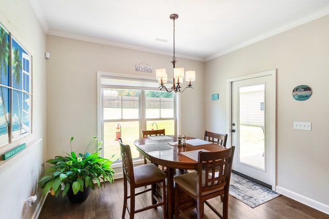 465 Choc Hill Rd, Dothan, AL 36303 - dining space with dark wood finished floors, a chandelier, healthy amount of natural light, and crown molding