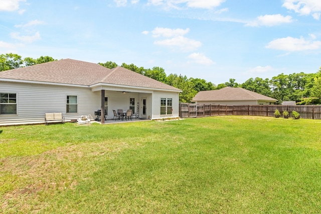 465 Choc Hill Rd, Dothan, AL 36303 - rear view of property featuring a fenced backyard, a ceiling fan, roof with shingles, and a patio