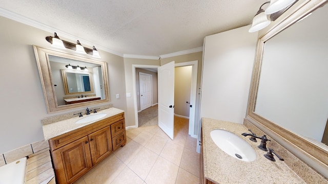 bathroom featuring a textured ceiling, vanity, crown molding, and tile patterned flooring