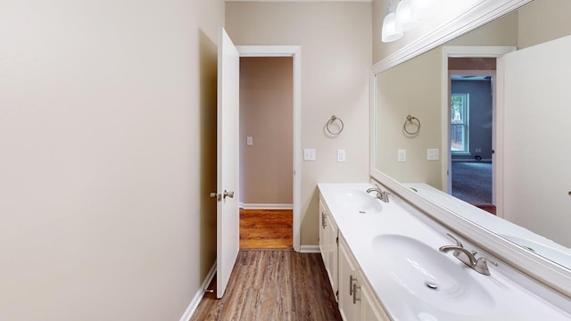 bathroom featuring vanity and hardwood / wood-style flooring