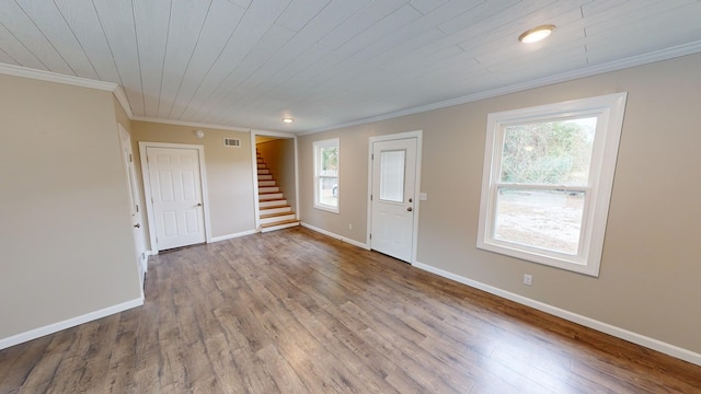 interior space featuring light hardwood / wood-style flooring, plenty of natural light, crown molding, and wood ceiling