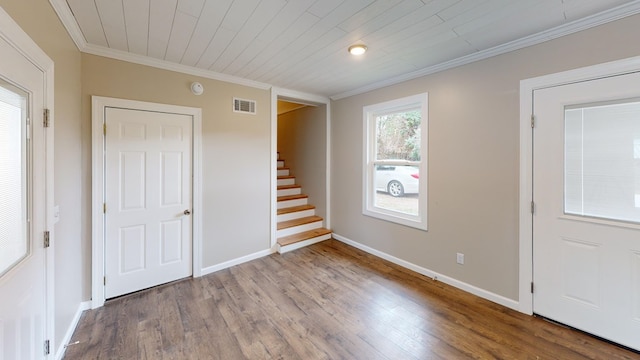 entryway featuring hardwood / wood-style floors, crown molding, and wooden ceiling