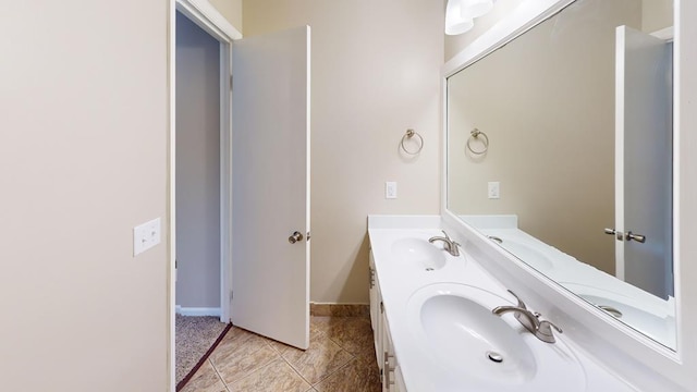 bathroom with tile patterned flooring and vanity