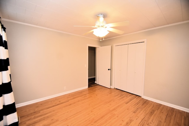 208 Pinehurst Dr, Enterprise, AL 36330 - unfurnished bedroom featuring light wood finished floors, crown molding, baseboards, a closet, and a ceiling fan
