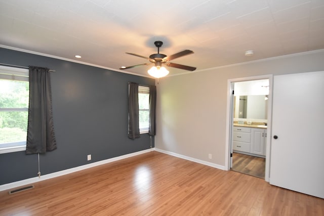 208 Pinehurst Dr, Enterprise, AL 36330 - spare room featuring healthy amount of natural light, ceiling fan, ornamental molding, light wood-style flooring, and baseboards
