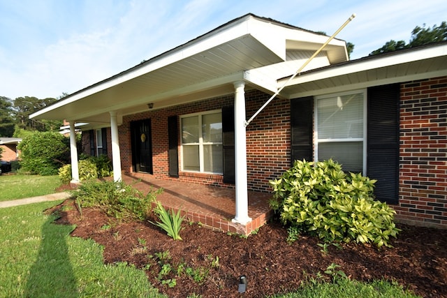 208 Pinehurst Dr, Enterprise, AL 36330 - view of home's exterior featuring brick siding and covered porch