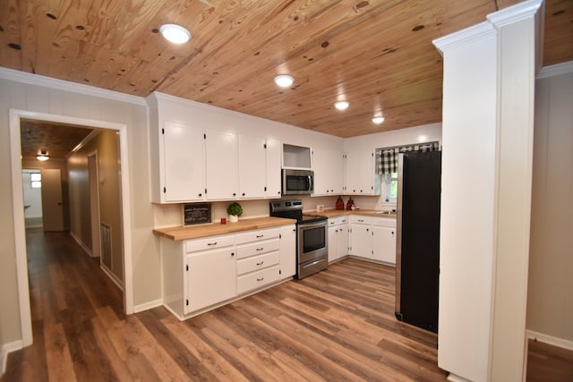 208 Pinehurst Dr, Enterprise, AL 36330 - kitchen with appliances with stainless steel finishes, wood ceiling, wood finished floors, ornamental molding, and white cabinets