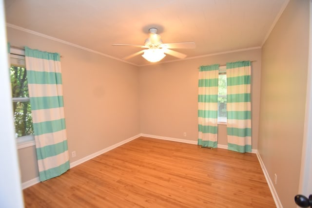 208 Pinehurst Dr, Enterprise, AL 36330 - spare room featuring a ceiling fan, wood finished floors, ornamental molding, and baseboards