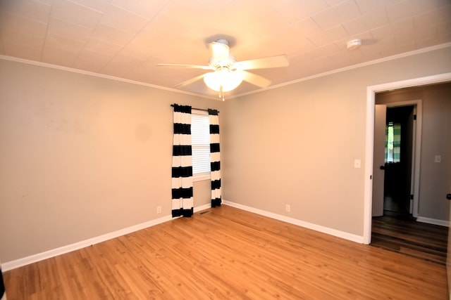 208 Pinehurst Dr, Enterprise, AL 36330 - empty room featuring a ceiling fan, crown molding, light wood-style floors, baseboards, and a smoke detector