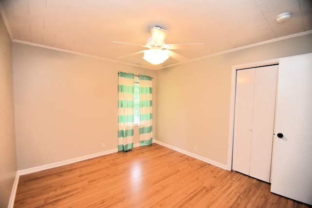 208 Pinehurst Dr, Enterprise, AL 36330 - unfurnished bedroom featuring crown molding, wood finished floors, baseboards, a closet, and a ceiling fan
