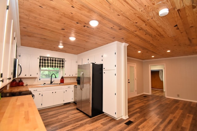 208 Pinehurst Dr, Enterprise, AL 36330 - kitchen featuring stainless steel appliances, wooden ceiling, a sink, butcher block counters, and dark wood finished floors