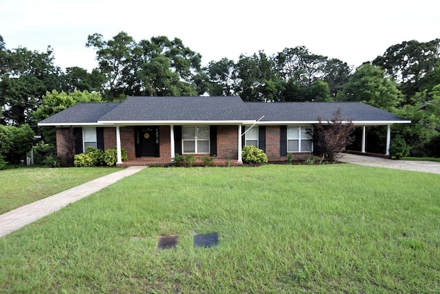 208 Pinehurst Dr, Enterprise, AL 36330 - single story home featuring a front yard, an attached carport, brick siding, concrete driveway, and view of scattered trees