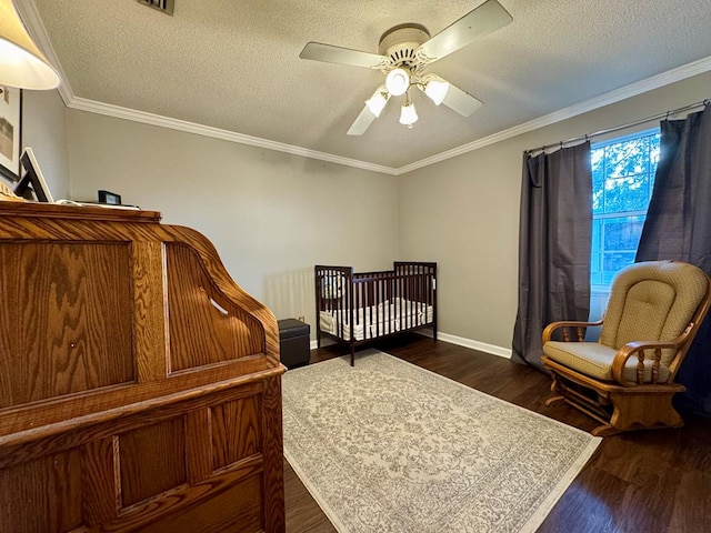 bedroom featuring a textured ceiling, ceiling fan, crown molding, and dark wood-type flooring