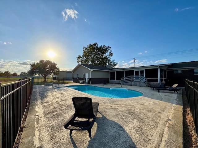 view of swimming pool with a patio