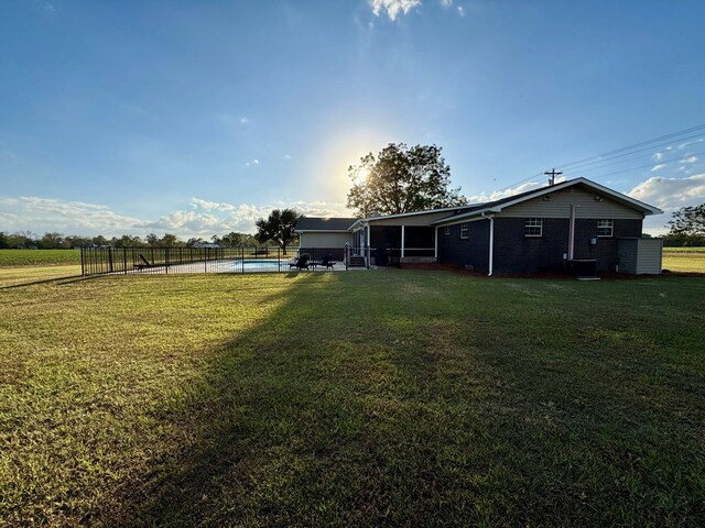 back of property featuring a yard