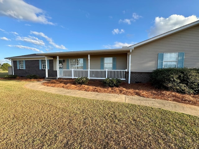 ranch-style home with a front lawn