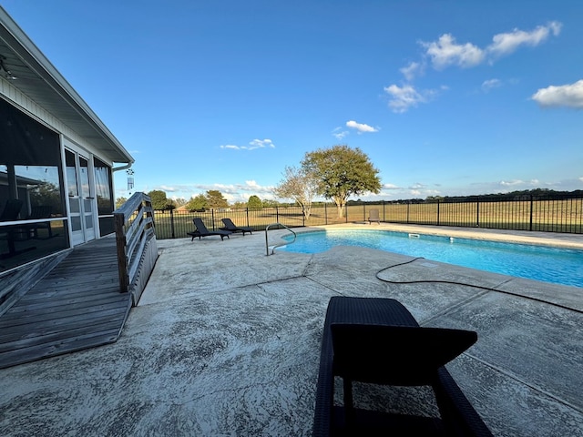 view of pool featuring a sunroom