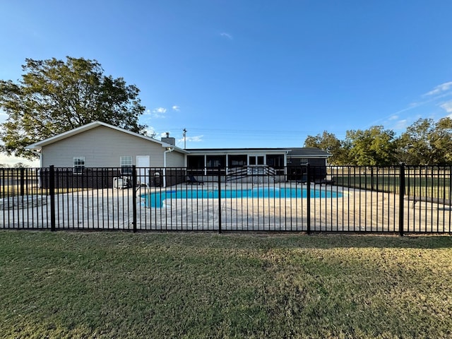 view of swimming pool with a patio area and a lawn