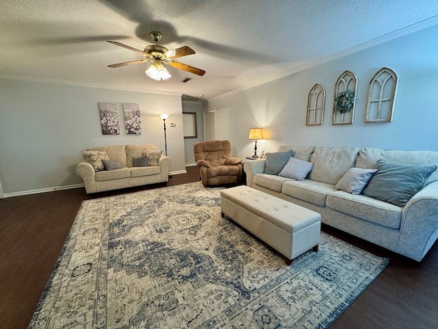 living room featuring ceiling fan, dark hardwood / wood-style flooring, ornamental molding, and a textured ceiling