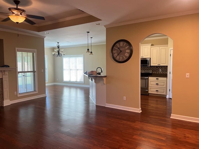 unfurnished living room featuring ornamental molding and dark wood-type flooring